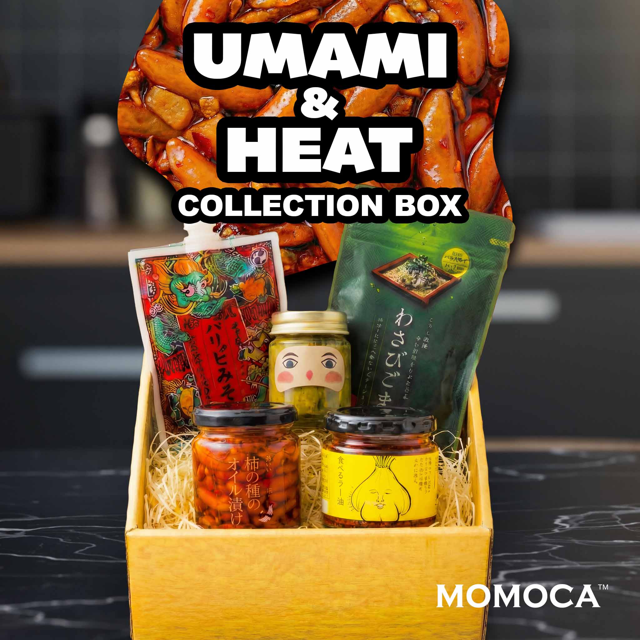 Collection box labeled 'UMAMI & HEAT' with various items on a kitchen counter, featuring the brand 'MOMOCA'.
