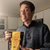 A man proudly displaying an authentic bag of chips from Japan.