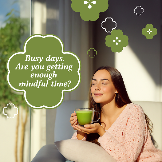 Woman holding a green mug with text about mindful time and decorative elements.
