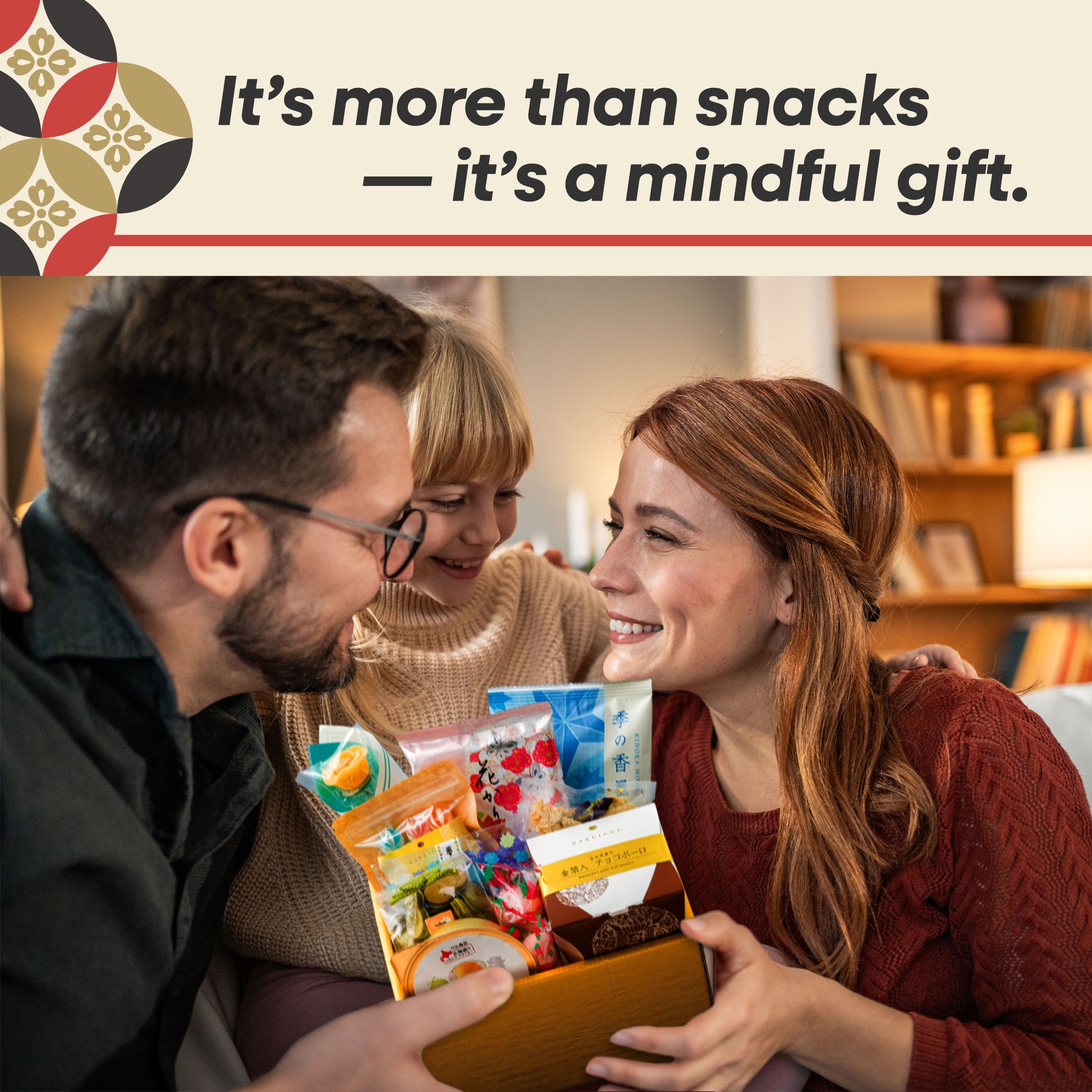 Two people holding a box of snacks with text 'It's more than snacks -- it's a mindful gift.'