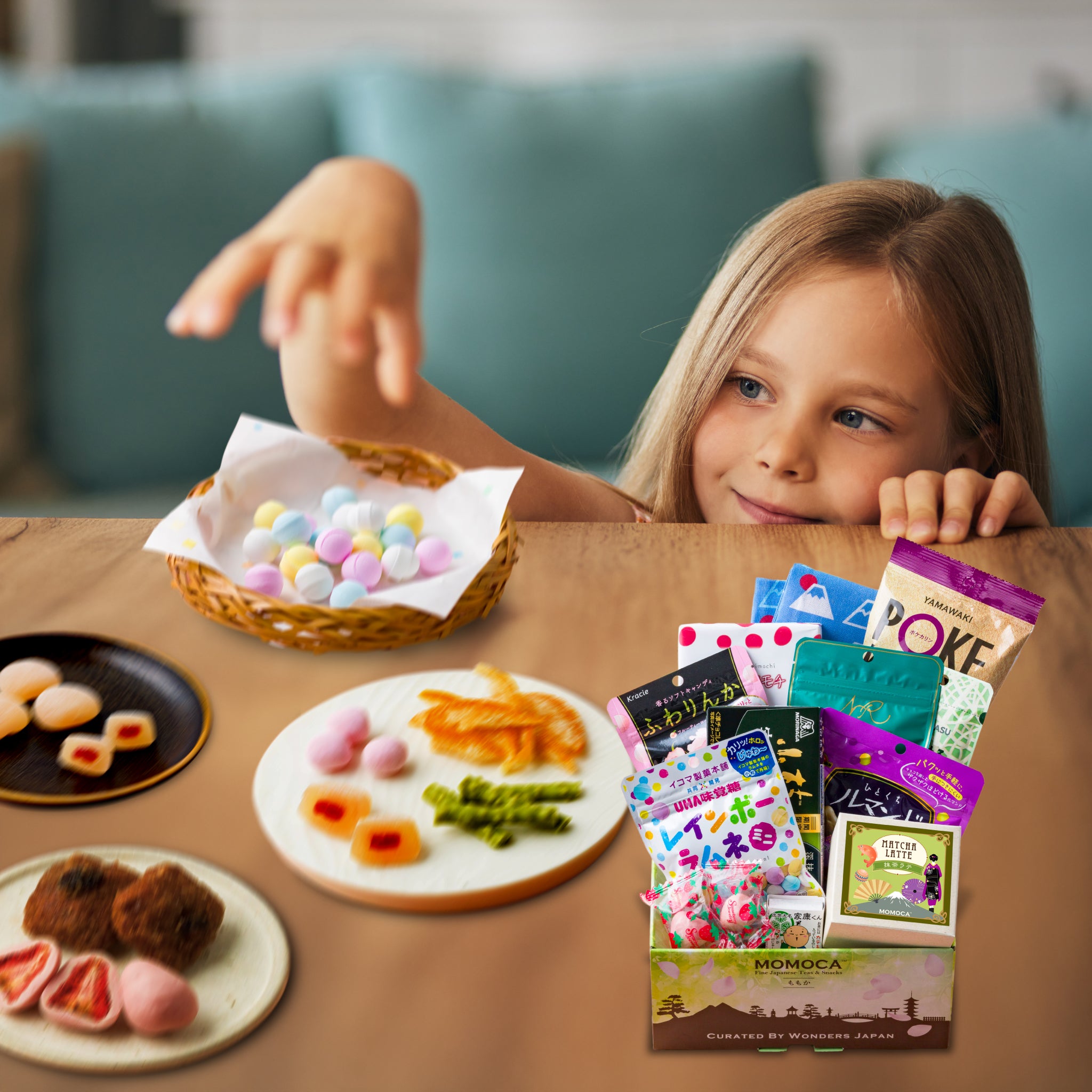 Child reaching for a snack at a table with various food items and packages.
