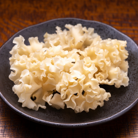 An authentic Japanese plate of white rice on a wooden table, perfect for pairing with flavorful Japanese snacks.