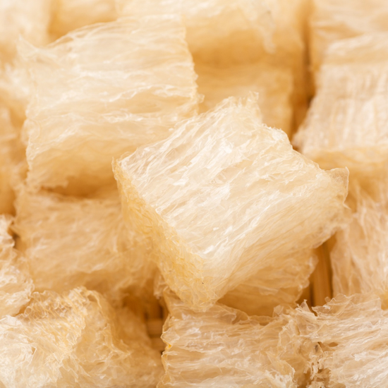 A close up image of a pile of white cubes.